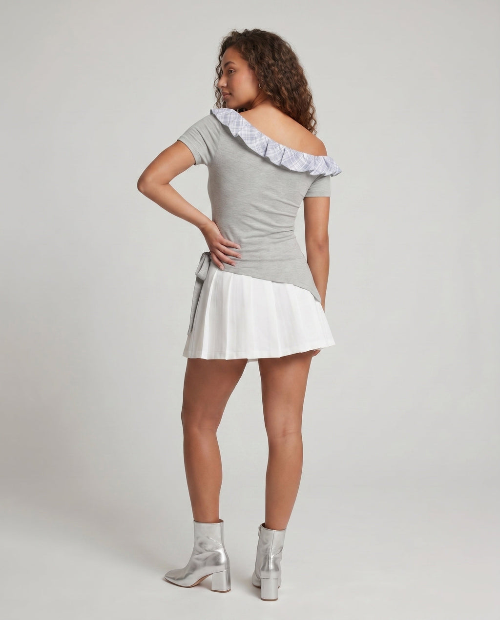 Women's dress with playful asymmetric cut and sophisticated ruffle design - back view