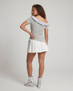 Women's dress with playful asymmetric cut and sophisticated ruffle design - back view