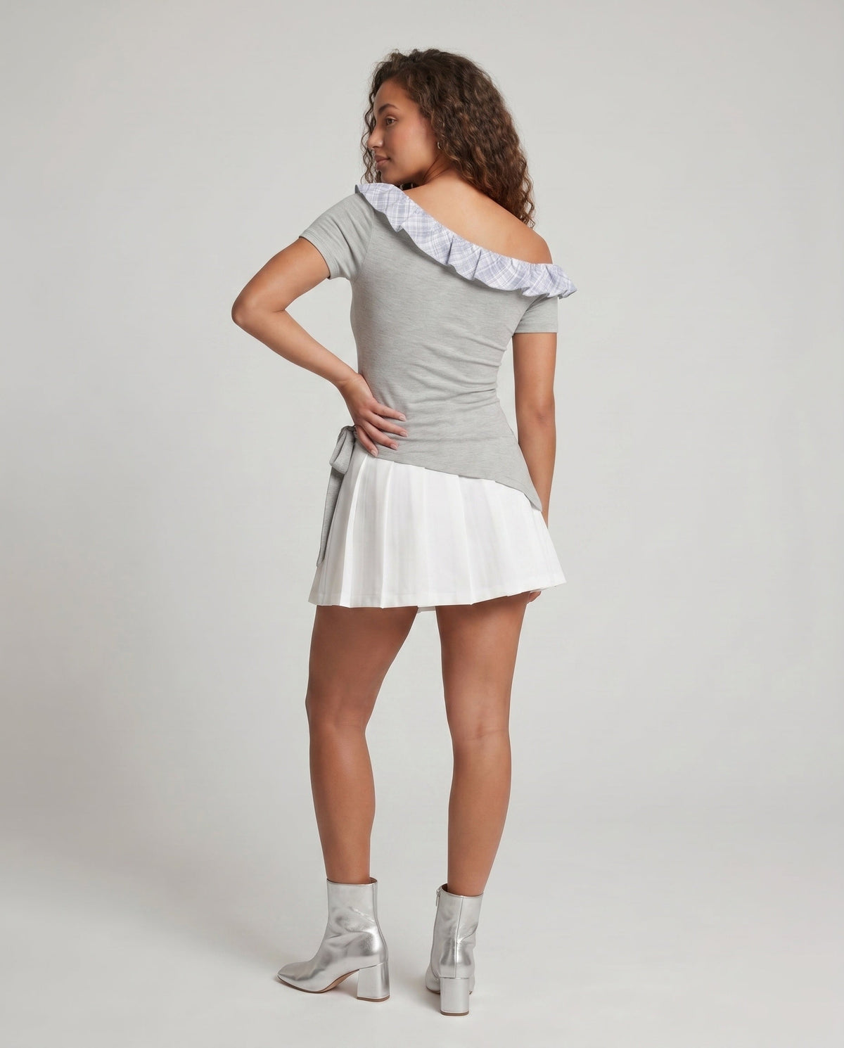 Women's dress with playful asymmetric cut and sophisticated ruffle design - back view