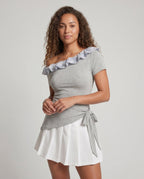Women's dress with playful asymmetric cut and sophisticated ruffle design - upper body view