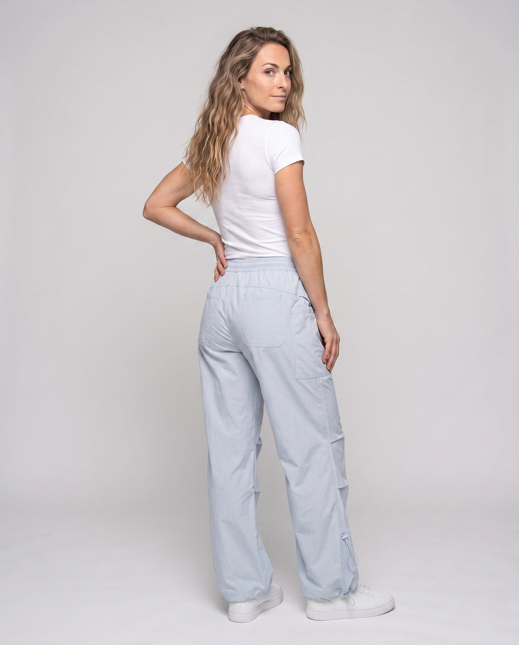 Women's lightweight cargo trousers with adjustable waistband and practical pockets - back view