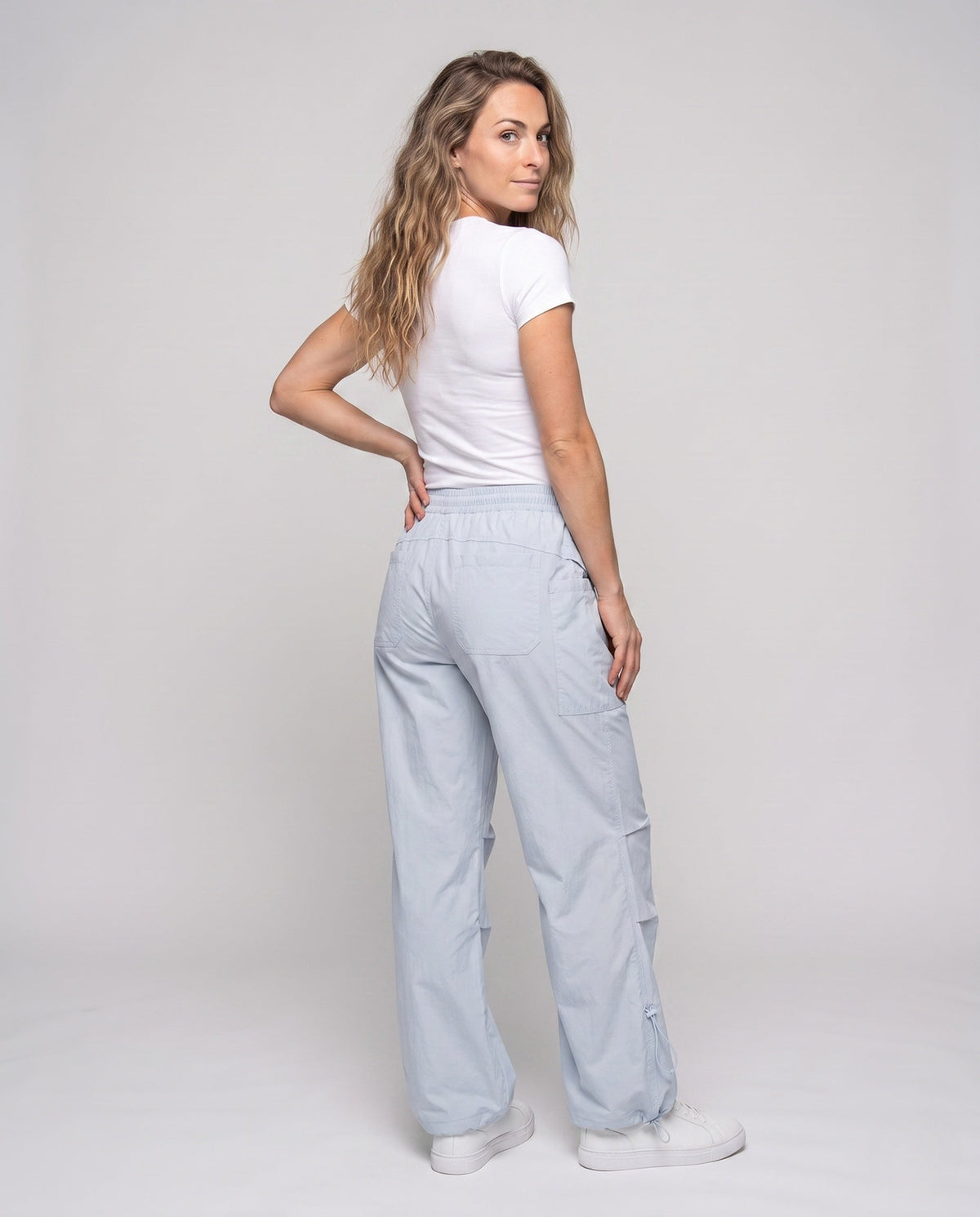 Women's lightweight cargo trousers with adjustable waistband and practical pockets - back view