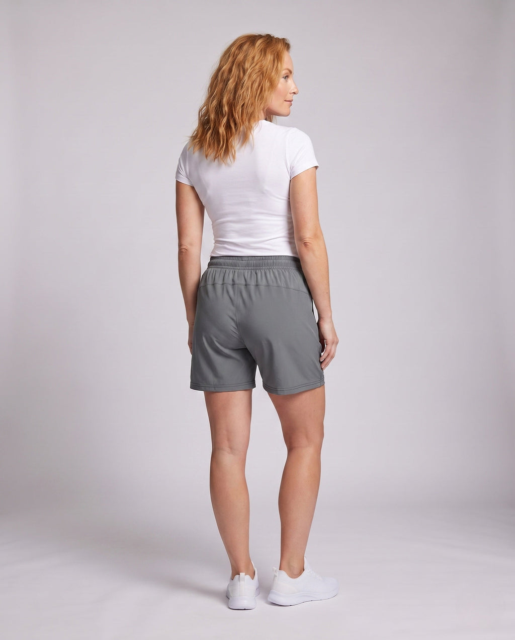 Women's lightweight sports shorts with zip pockets - back view