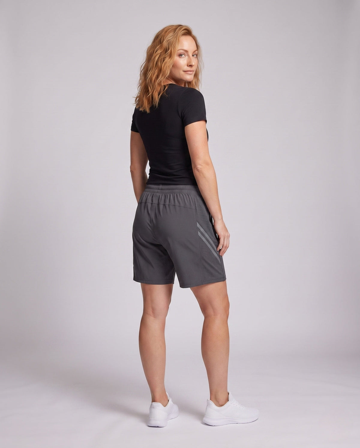 Women's sporty functional shorts with breathable mesh panels - back view
