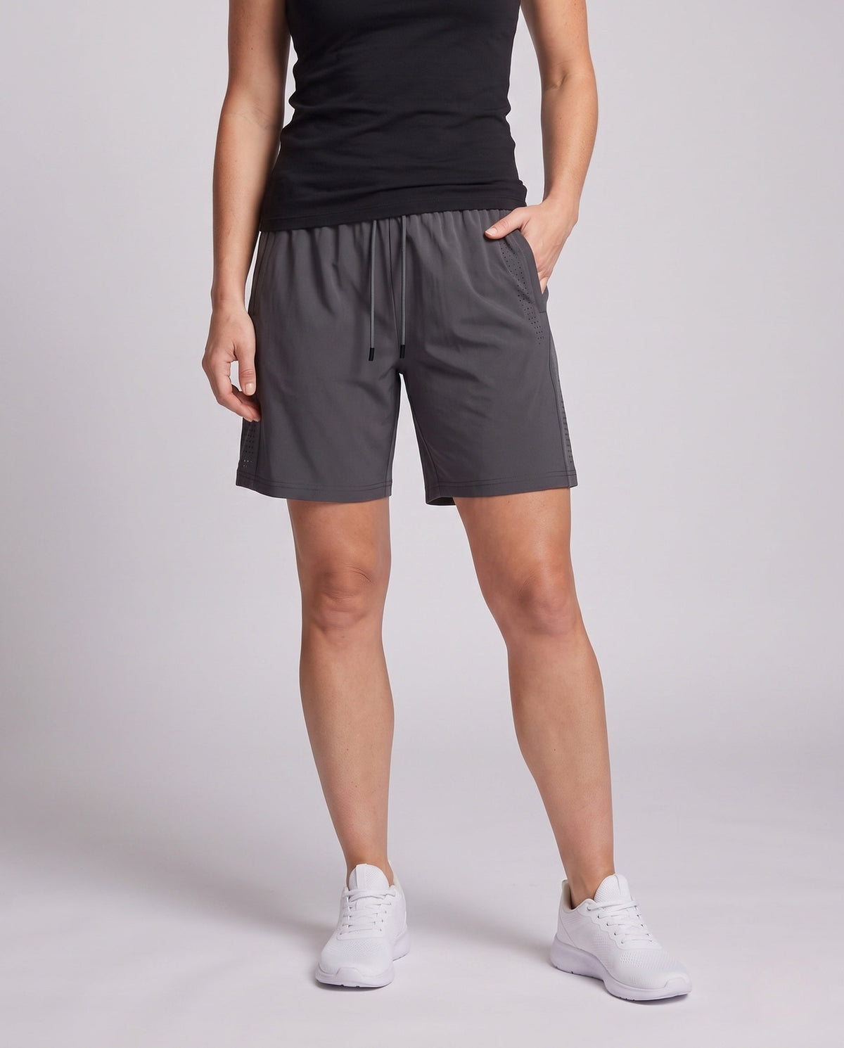 Women's sporty functional shorts with breathable mesh panels - lower body view