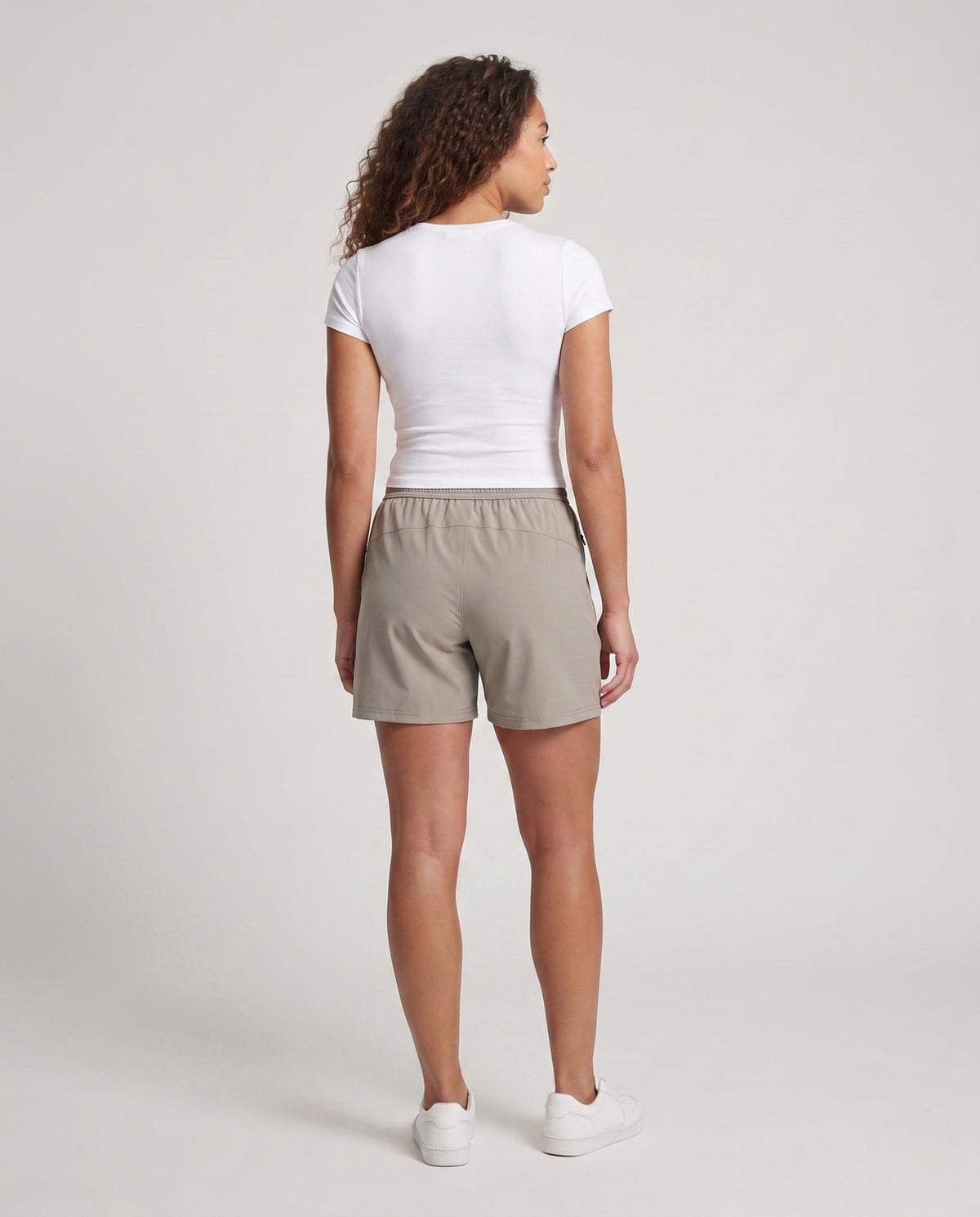 Women's sporty shorts with functional zip pockets - back view