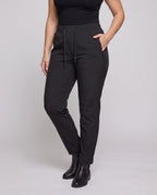 Women’s technical cargo pants with elastic waistband and practical zip pockets - lower body view