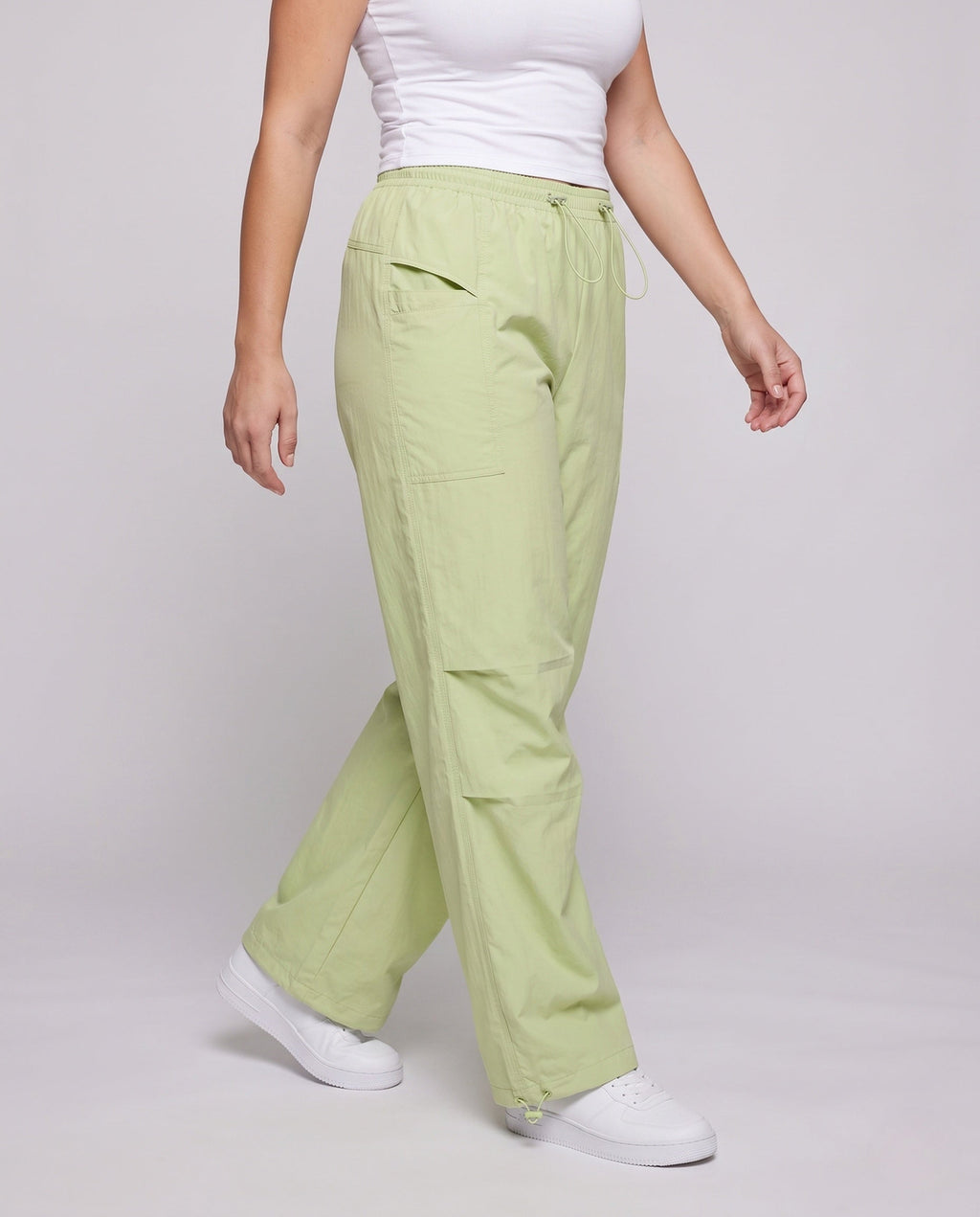 Women's technical cargo pants with adjustable waistband and multifunctional pockets - lower body view