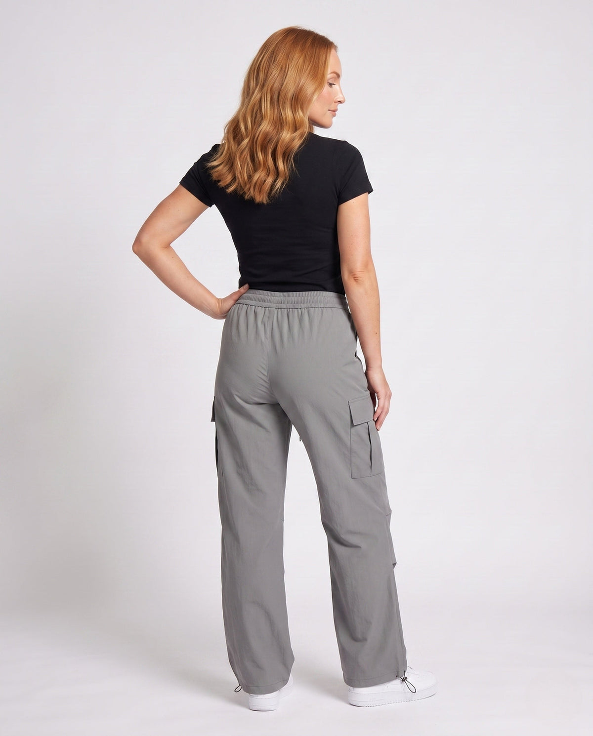 Women's cargo pants with practical side pockets and elastic waistband - back view