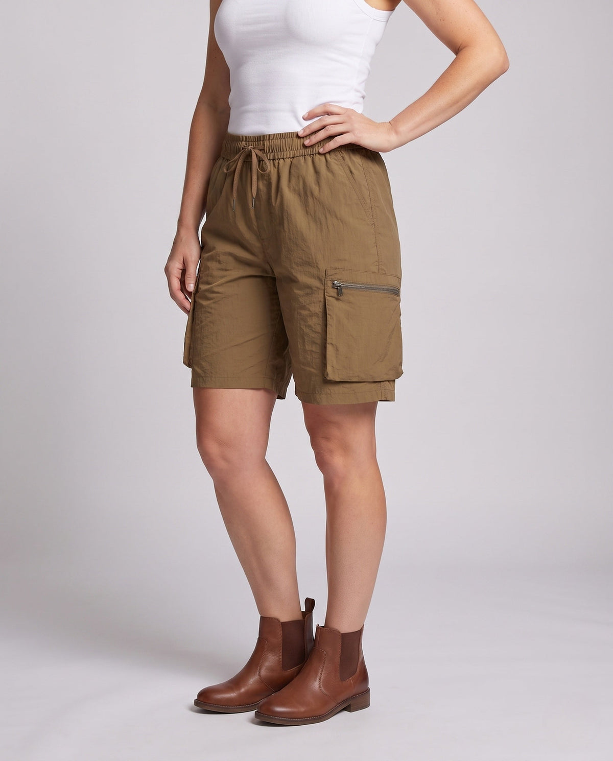 Women's sporty cargo shorts with practical zip pockets - lower body view