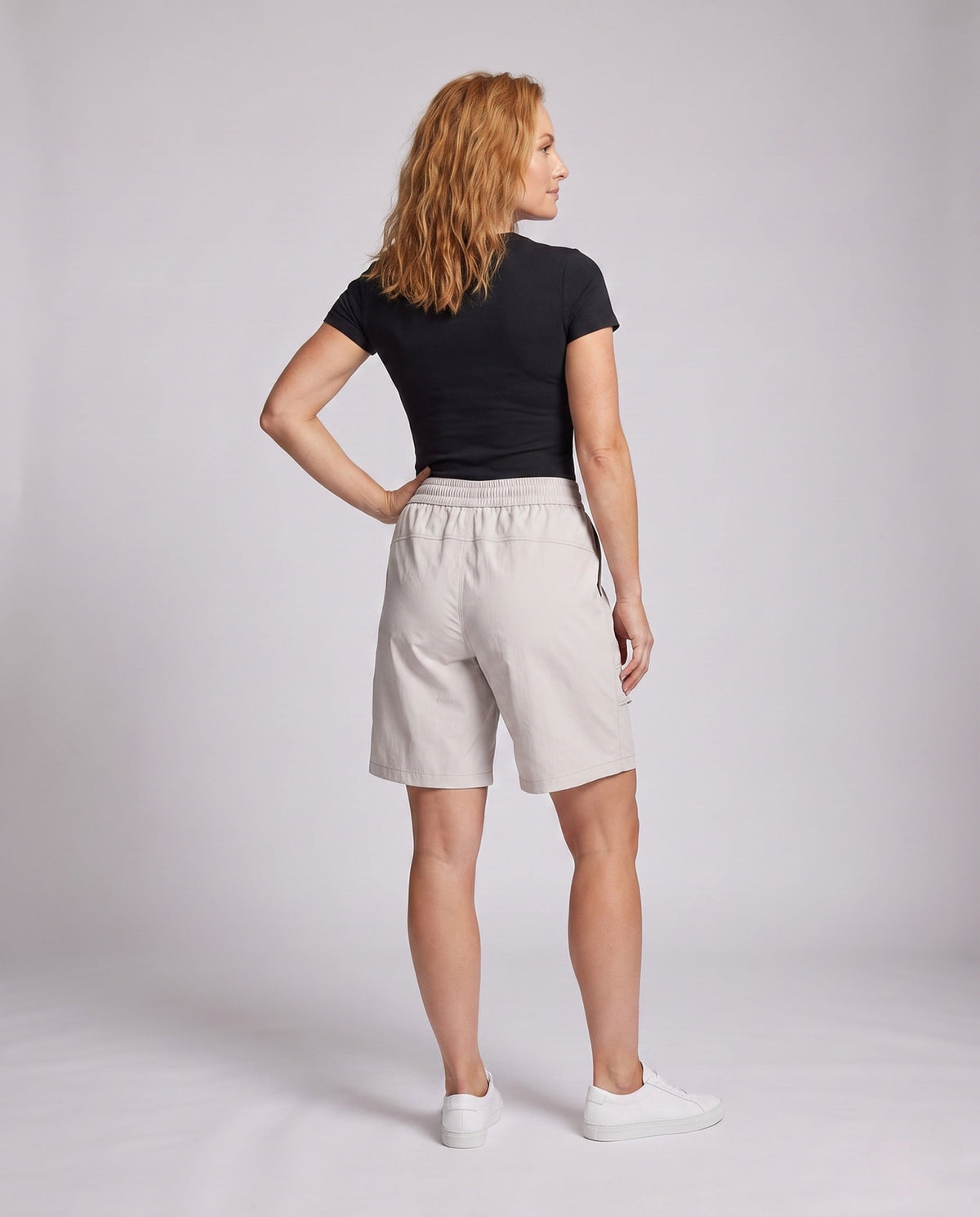Women's sporty shorts with practical side pockets - back view
