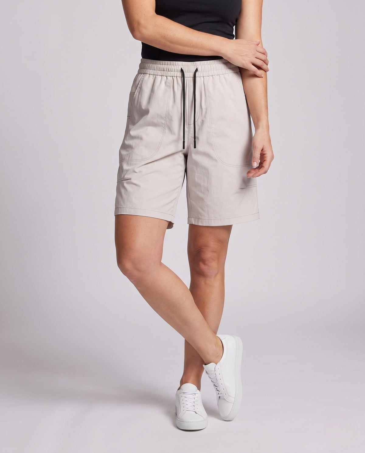 Women's sporty shorts with practical side pockets - lower body view