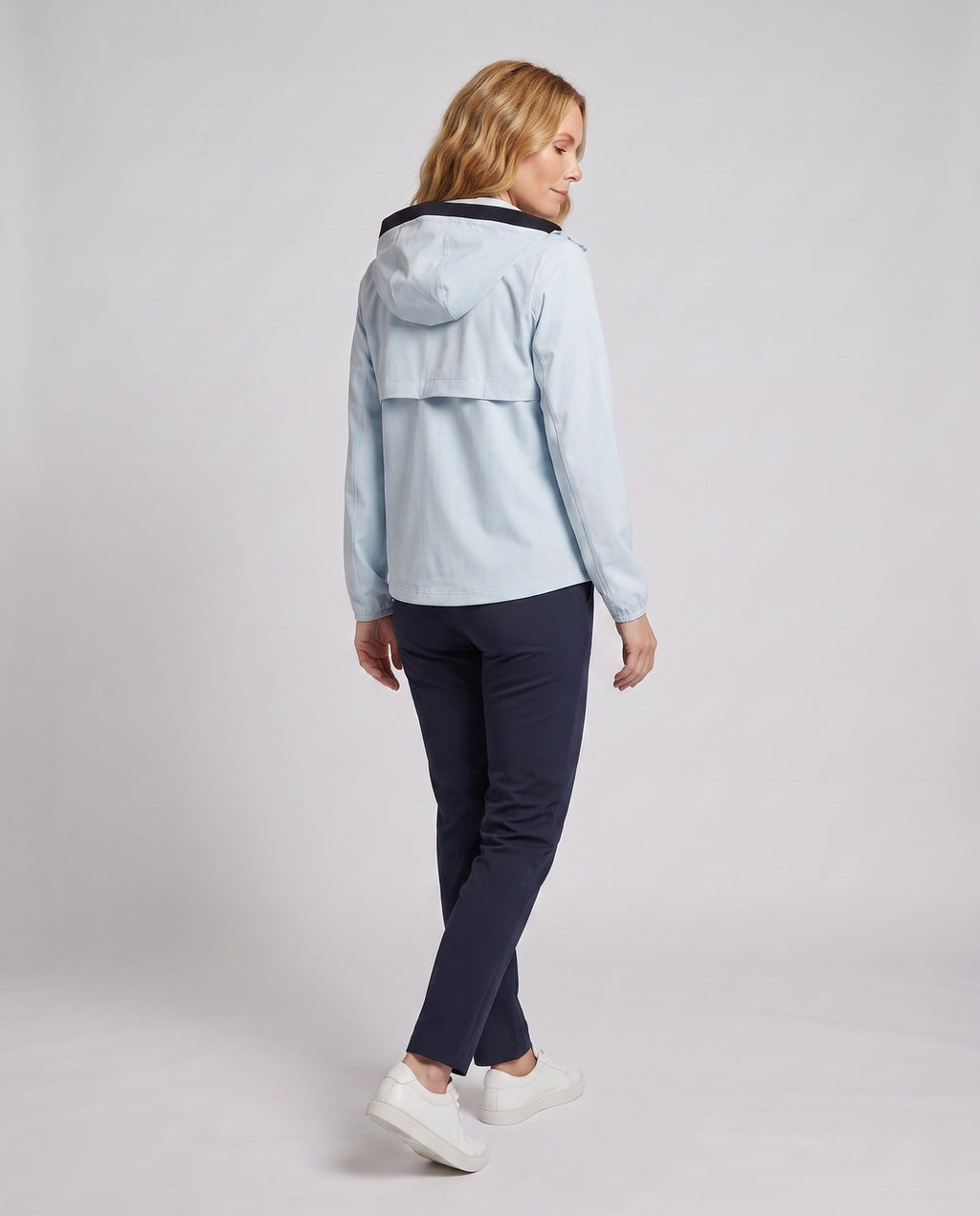 Women's lightweight functional jacket with stowable hood design All Fashion - back view
