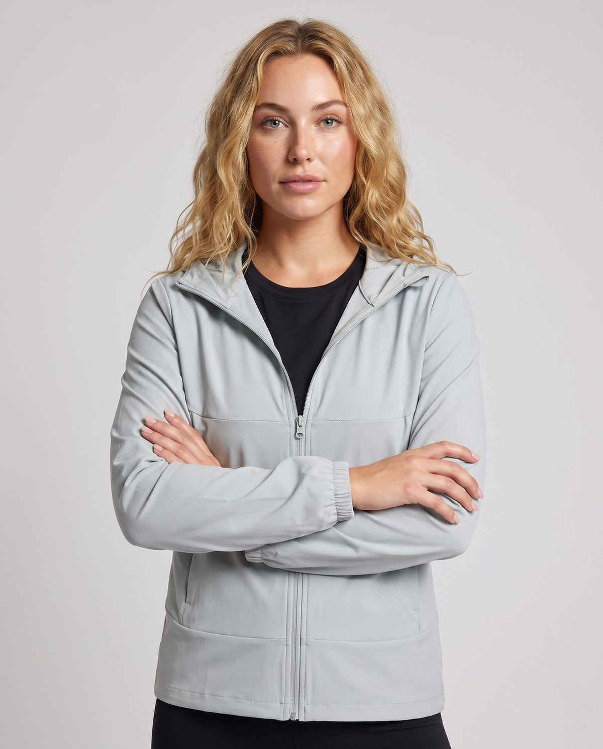 Women's lightweight running and leisure jacket with hood, elastic cuffs, and concealed zip pockets All Fashion - upper body view