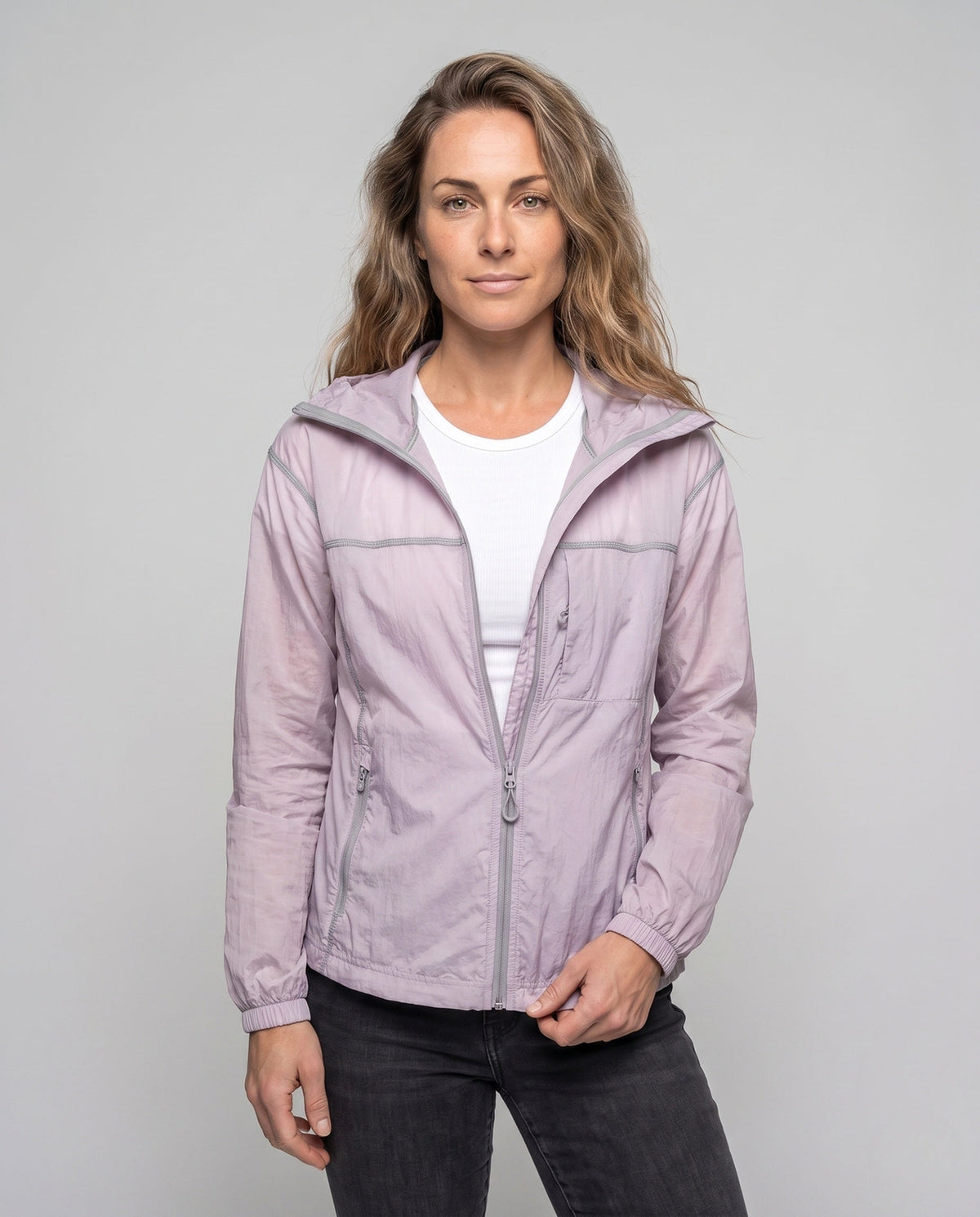 Unisex nan minimalist all-weather outdoor jacket with hood, windproof material, concealed zip pockets, and elastic hem All Fashion - upper body view