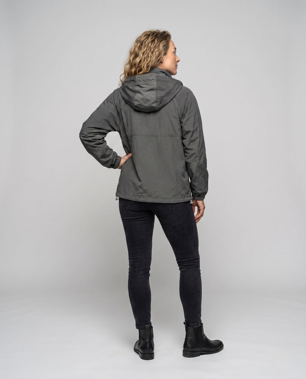 Unisex nan technical packable hooded windbreaker with 2-way zipper, ventilation inserts and adjustable hem All Fashion - back view
