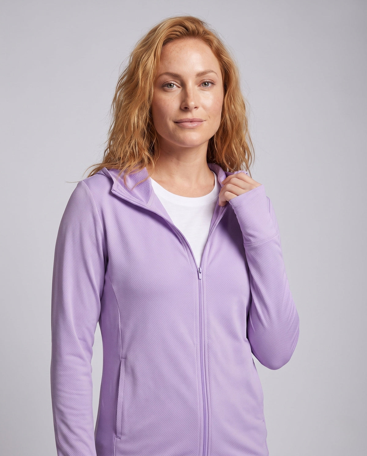 Women's lightweight functional hooded jacket with honeycomb structure, mesh inner lining, side zipper pockets, and thumb holes All Fashion - upper body view