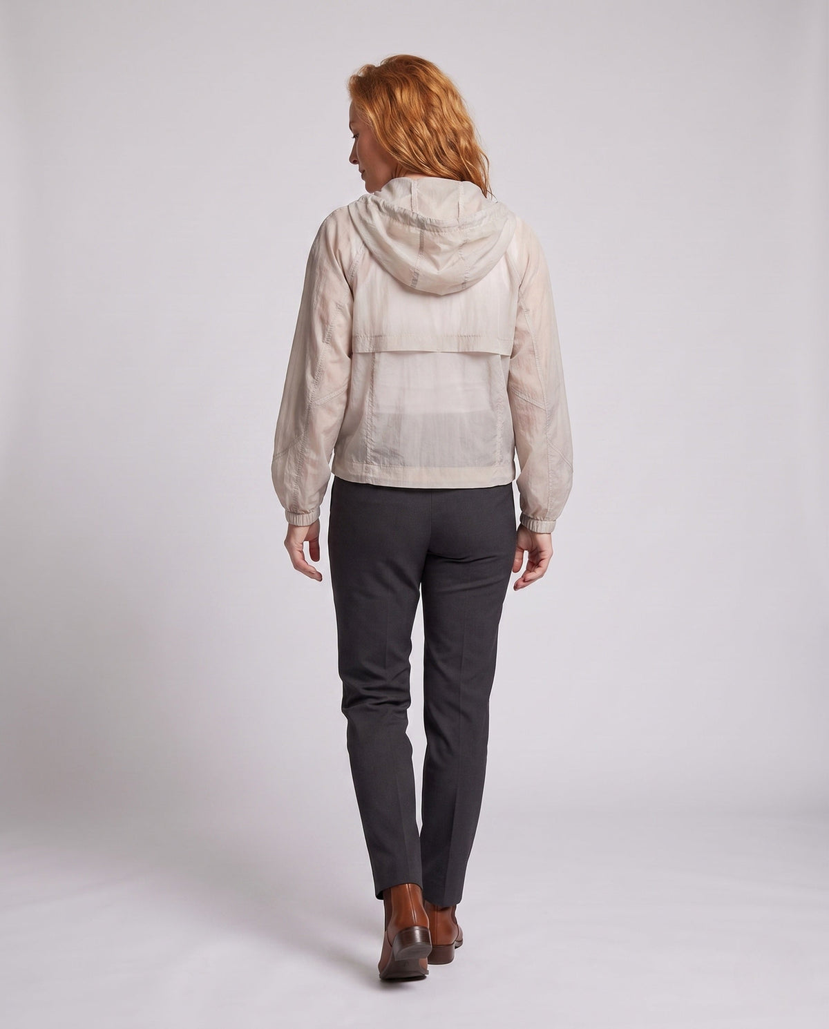 Women's lightweight short jacket in cargo style with hood, balloon sleeves, and patched pockets All Fashion - back view