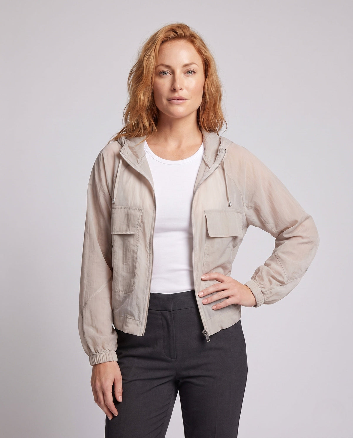 Women's lightweight short jacket in cargo style with hood, balloon sleeves, and patched pockets All Fashion - upper body view