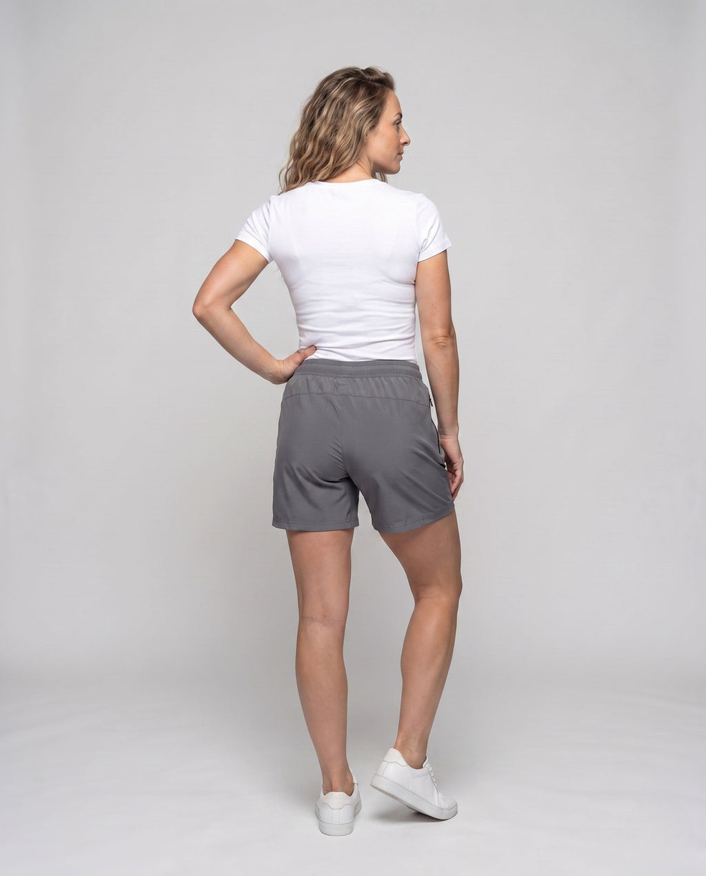 Women's sporty shorts with elastic waistband and breathable material - back view