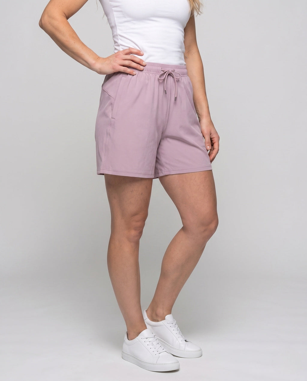 Women's sporty shorts with elastic waistband and practical pockets - lower body view