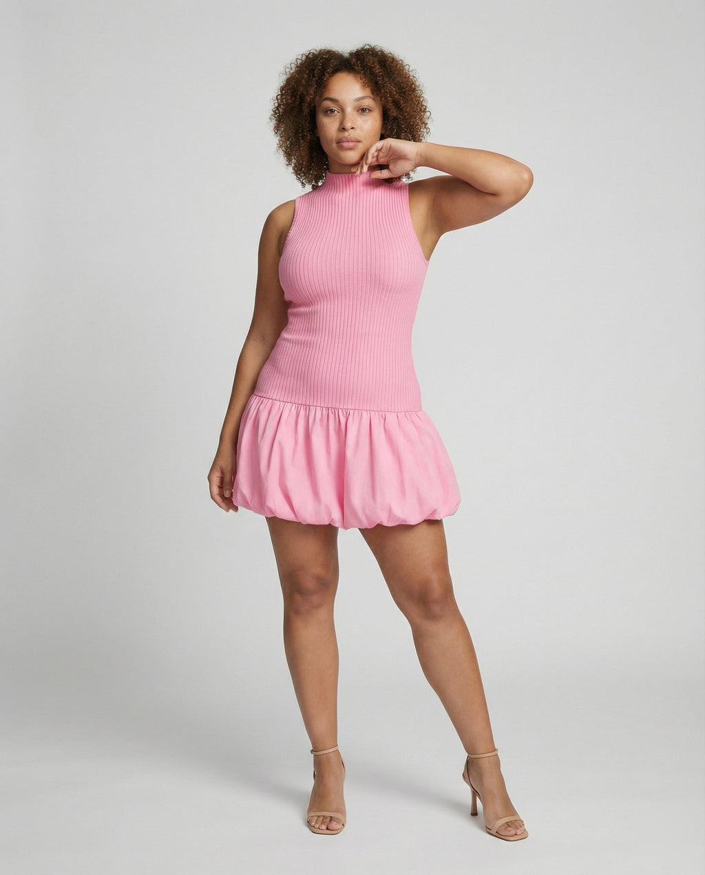 Women’s dress with sleeveless, figure-hugging top and voluminous skirt