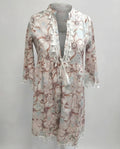 Women's beach dress with high collar and romantic floral pattern