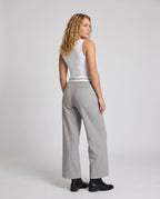 Women's elegant cropped trousers with stylish pleat design - back view