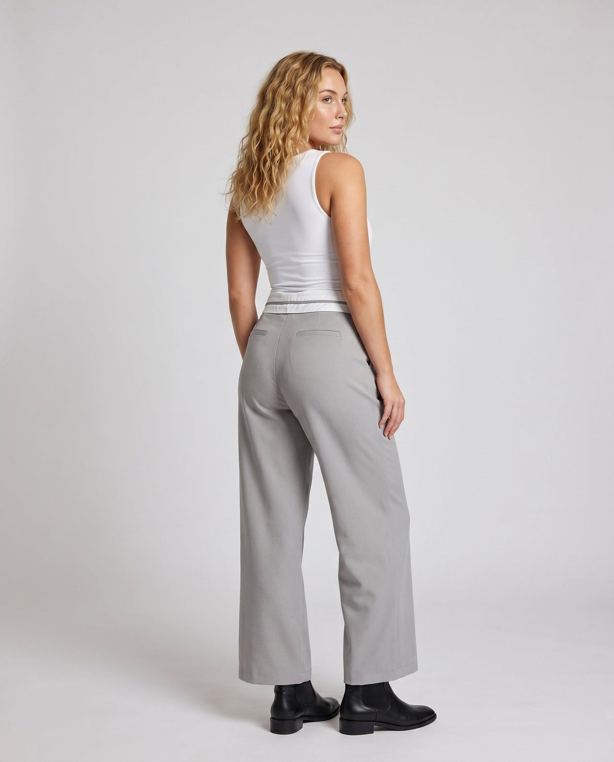 Women's elegant cropped trousers with stylish pleat design - back view