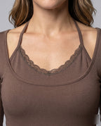Women's form-fitting dress with additional ruffle details and luxurious overlay - detail close-up