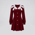Women's dress with decorative buttons and voluminous sleeves - product shot