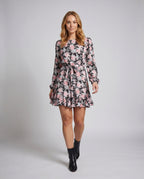 Women's blouse dress with floral ruffles and tie belt - front view